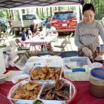 A vendor on the grounds of the Pii Mai celebration at the Lao Buddhist temple in Charlotte, NC.
